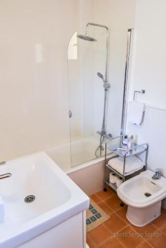 a bathroom with a sink and a shower and a toilet at Apartment Higuerón in Fuengirola