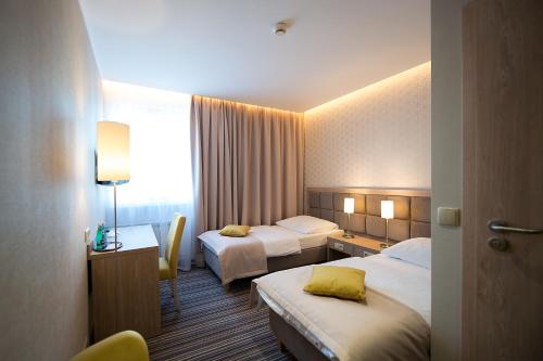 Ένα ή περισσότερα κρεβάτια σε δωμάτιο στο Hotel Almarco