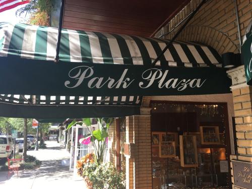 a black and white striped awning on a restaurant at Park Plaza Hotel Orlando - Winter Park in Orlando