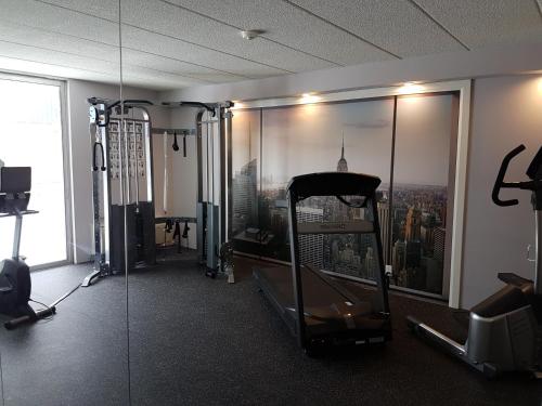 a room with a gym with a view of a city at Northbury Hotel and Conference Centre in Sudbury