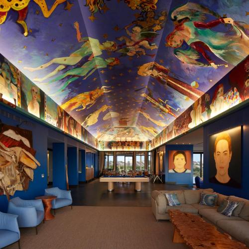 a room with a ceiling covered in paintings at Bahia Vik in José Ignacio