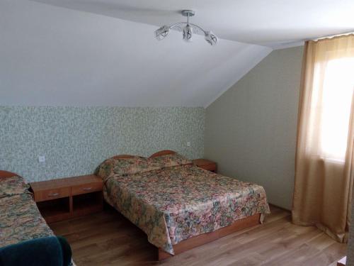 Een bed of bedden in een kamer bij Guest House Elena
