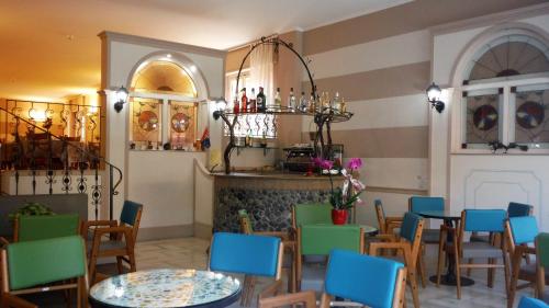 a restaurant with tables and chairs and a fireplace at Primavera in Levanto