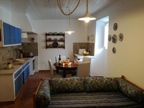 a living room with a couch and a table at Patio da Memoria in Palmela