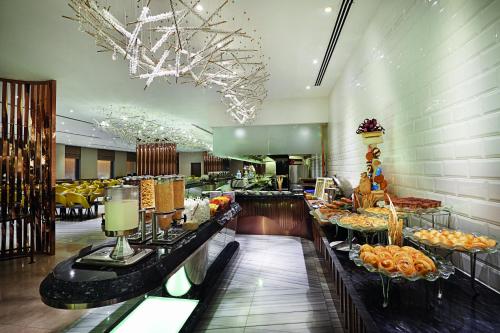 a buffet area of a hotel with food on display at Dorsett Kuala Lumpur in Kuala Lumpur