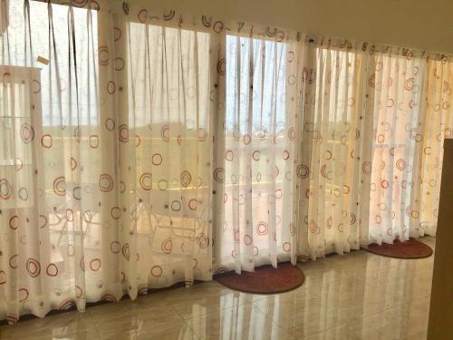 a row of curtains in a room with mats at Tamowan in Donghe