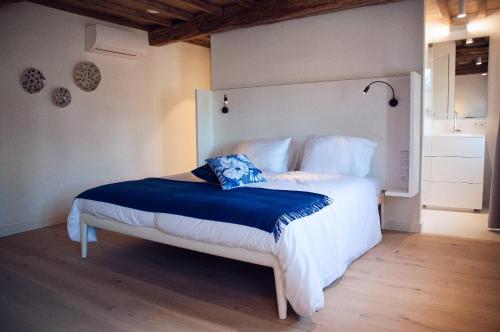 Säng eller sängar i ett rum på Maison Village