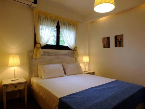 Ένα ή περισσότερα κρεβάτια σε δωμάτιο στο Christaras Apartments