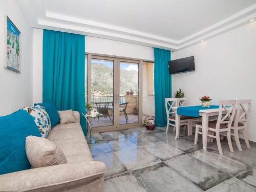 a living room with a couch and a table at Apartments Castello in Kotor