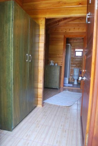 an empty room with a toilet in a wooden cabin at Portalimo Lodge Hotel - Adult Only +12 in Cıralı