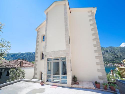 a villa with a view of the water at Apartments Castello in Kotor