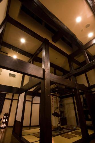 a large wooden cross on the ceiling of a room at Oyado Koto No Yume in Takayama