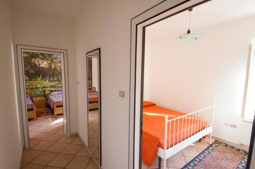 a bedroom with a bed and a mirror at Bed & Breakfast Porta Santi in Cesena