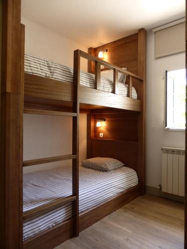 a bunk bed room with two bunk beds at Quinta do Burgo - Nature Hotel in Amares
