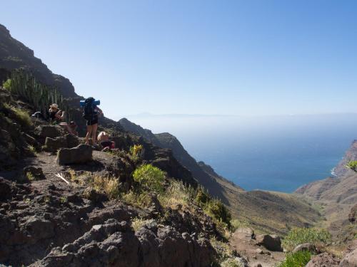 a group of people on the side of a mountain at Lua Lua Hostel Las Palmas in Las Palmas de Gran Canaria