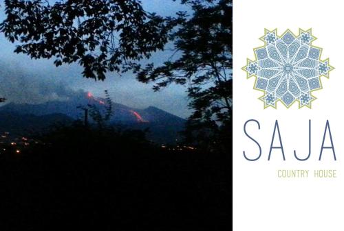 a sign that says saala with a picture of a mountain at Saja Country House in Acireale