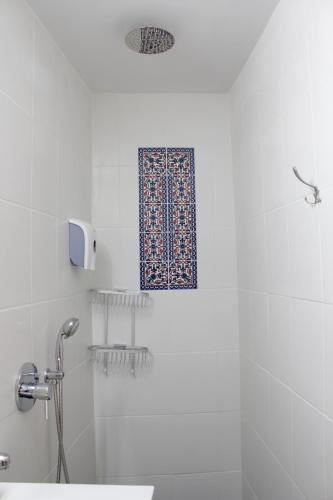 a bathroom with a shower with a shower curtain at Mark House in Nazareth
