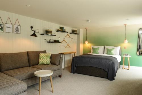 a bedroom with a bed and a couch at The Litton in Litton