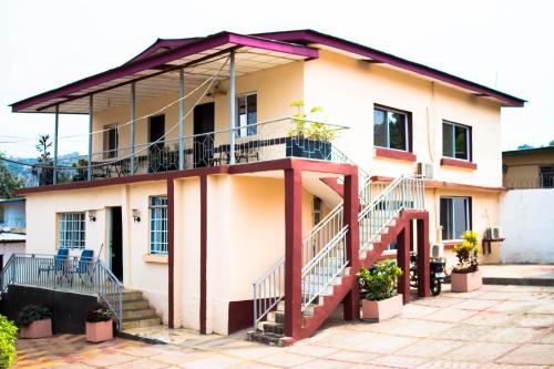 a building with a staircase in front of it at The Jam Lodge in Freetown