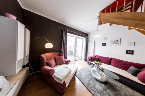 a living room with a couch and a table at harz-traum in Gernrode - Harz