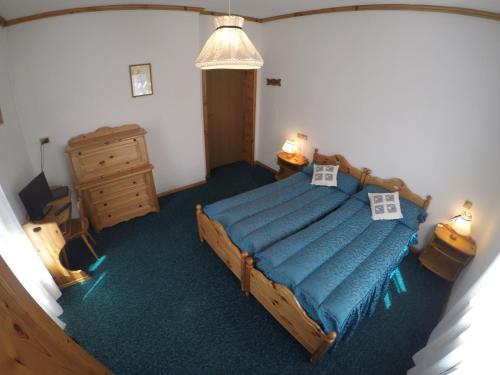 Posteľ alebo postele v izbe v ubytovaní Hotel Fiames