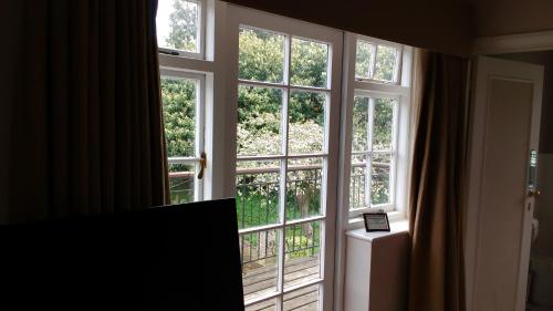 an open window with a view of a balcony at The Bell House in Sutton Benger
