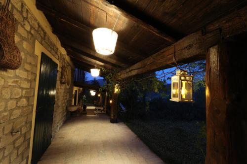 a walkway with lights on the side of a building at Chiesa Ignano 1778 in Marzabotto