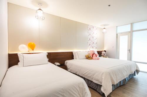 Säng eller sängar i ett rum på Da Pu Hotspring Hotel
