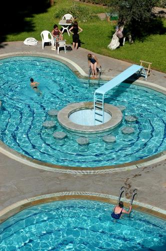 a large swimming pool with a slide in it at Menzeh Zalagh 2Boutique Hôtel & Sky in Fès