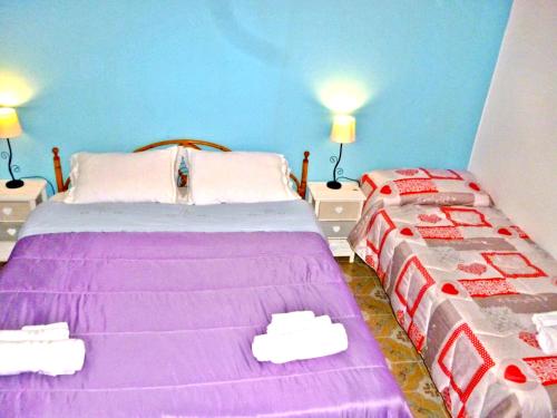 Ένα ή περισσότερα κρεβάτια σε δωμάτιο στο I Cinque Continenti