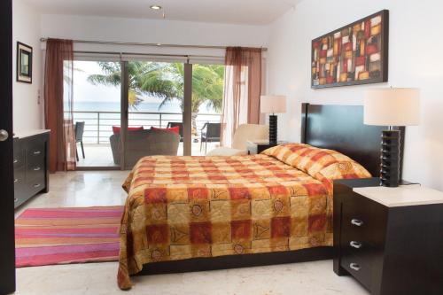 A bed or beds in a room at Ocean Front Corto Maltes 104 in Downtown