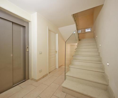 a hallway with a staircase in a house at Juliet House in Verona