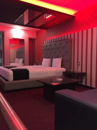 En eller flere senge i et værelse på Intimisimo Autohotel Adults Only Ciudad Industrial