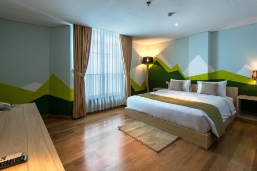 Postel nebo postele na pokoji v ubytování Yan's House Hotel