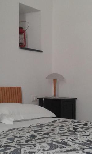 a bedroom with a bed and a basketball hoop on the wall at La Scala Vernazza CinqueTerre in Vernazza