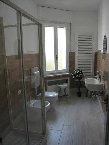 a bathroom with a toilet and a sink at Le Maschere in Mestre