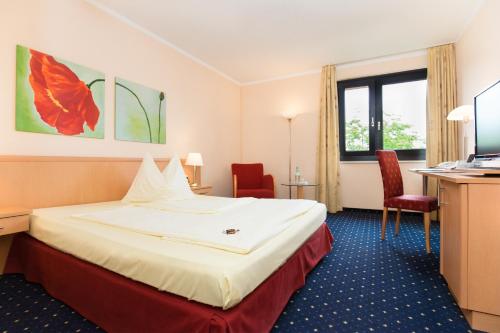 Postel nebo postele na pokoji v ubytování Montana Parkhotel Marl