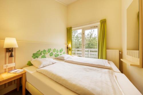 Postel nebo postele na pokoji v ubytování Center Parcs Port Zélande beach