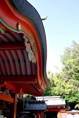 a close up of a building with a tire on it at Dormy Inn Miyazaki Natural Hot Spring in Miyazaki