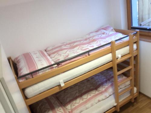 a couple of bunk beds in a room at Chalet Seviann in Rosswald