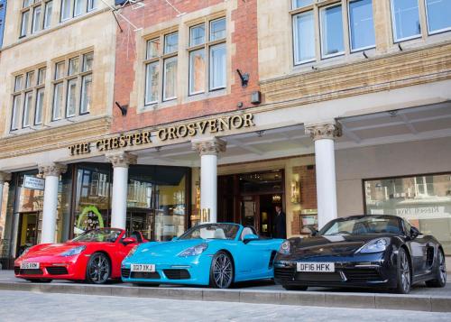 two cars parked in front of a building at The Chester Grosvenor in Chester