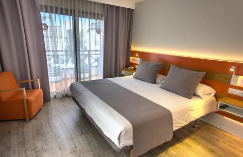 Ένα ή περισσότερα κρεβάτια σε δωμάτιο στο Vanilla Garden Boutique Hotel - Adults Only