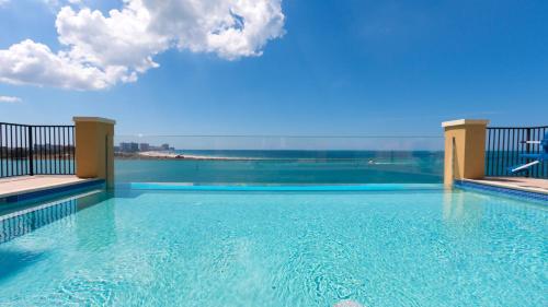 a swimming pool with a view of the water at Edge Hotel Clearwater Beach in Clearwater Beach