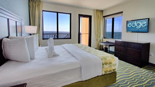 En eller flere senge i et værelse på Edge Hotel Clearwater Beach