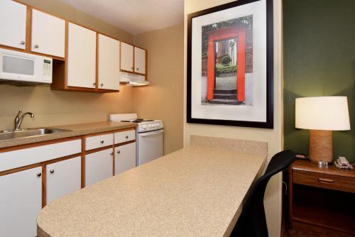 a kitchen with a white counter top and white cabinets at Extended Stay America Suites - Tampa - Airport - Memorial Hwy in Tampa