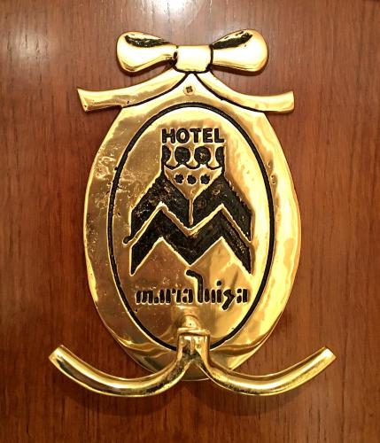 a brass emblem of a hotel with aigil at Hotel Maria Luisa in Burgos