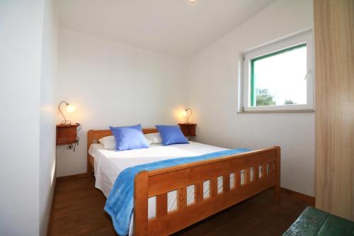 Postel nebo postele na pokoji v ubytování Holliday home Robinson Tourism Maria
