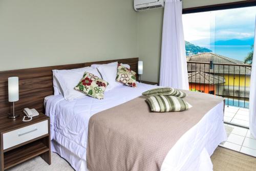 Voodi või voodid majutusasutuse Portogalo Suite Hotel toas