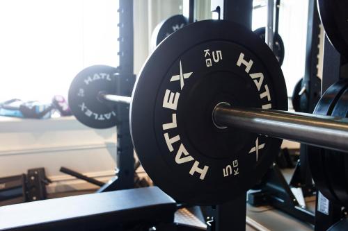 a barbell in a gym with other equipment at Best Western Hotel Baltic in Sundsvall