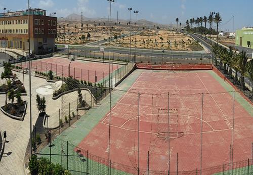 a tennis court with two tennis courts at Apartamento fuerte in Puerto del Rosario